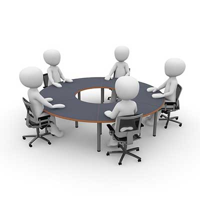 cartoon figures sitting around meeting table