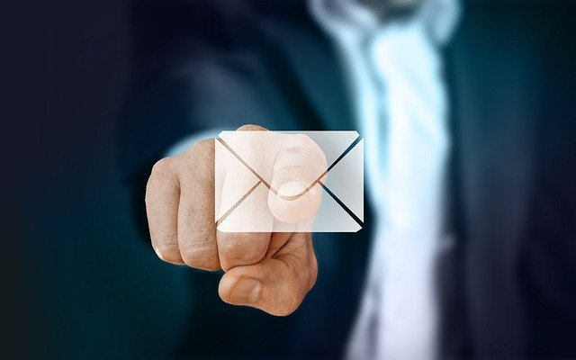 decorative image of a man touching a virtual envelope