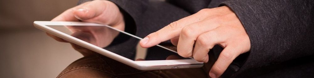 decorative image of a man with an ipad